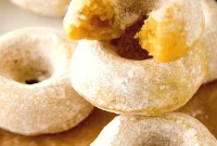 Mini Pumpkin Donuts Dusted with Powdered Sugar