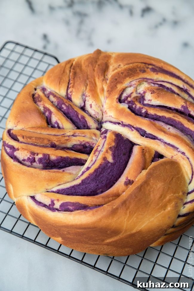 ube swirl bread on wire cooling rack