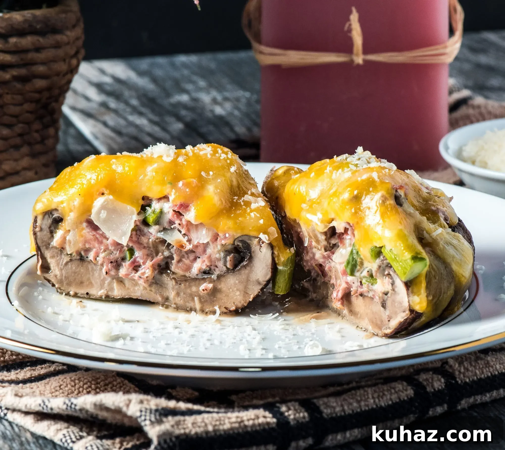 Two cut stuffed portobello mushrooms with cheese