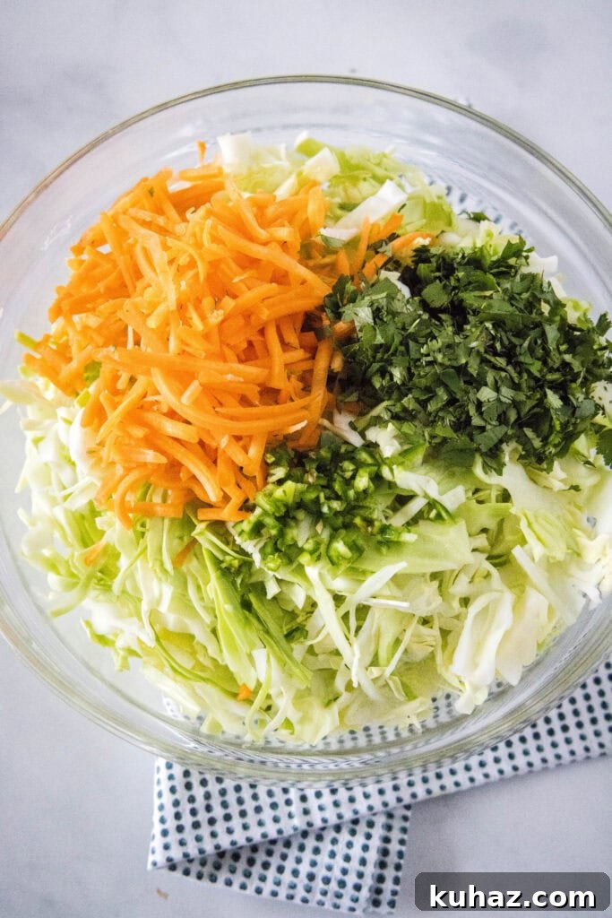 Zesty Mexican Coleslaw with Lime and Cilantro 4 mixing everything together for coleslaw