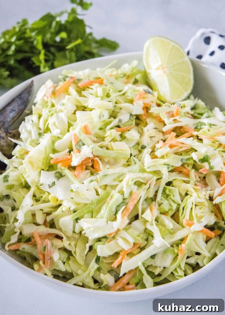 Zesty Mexican Coleslaw with Lime and Cilantro 6 white bowl with coleslaw in a lime wedge