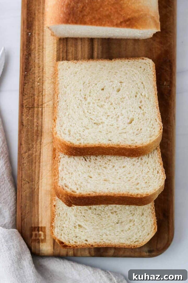 Homemade Buttermilk Bread Recipe: Soft, Tender Loaf 11 Three slices of Soft and Tender Buttermilk Bread on cutting board.