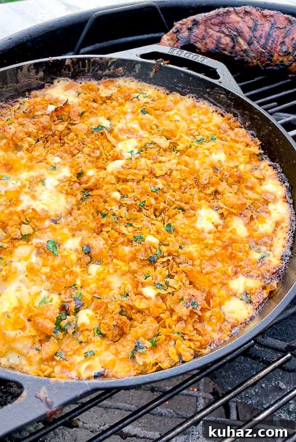 right side of skillet of cheesy potatoes