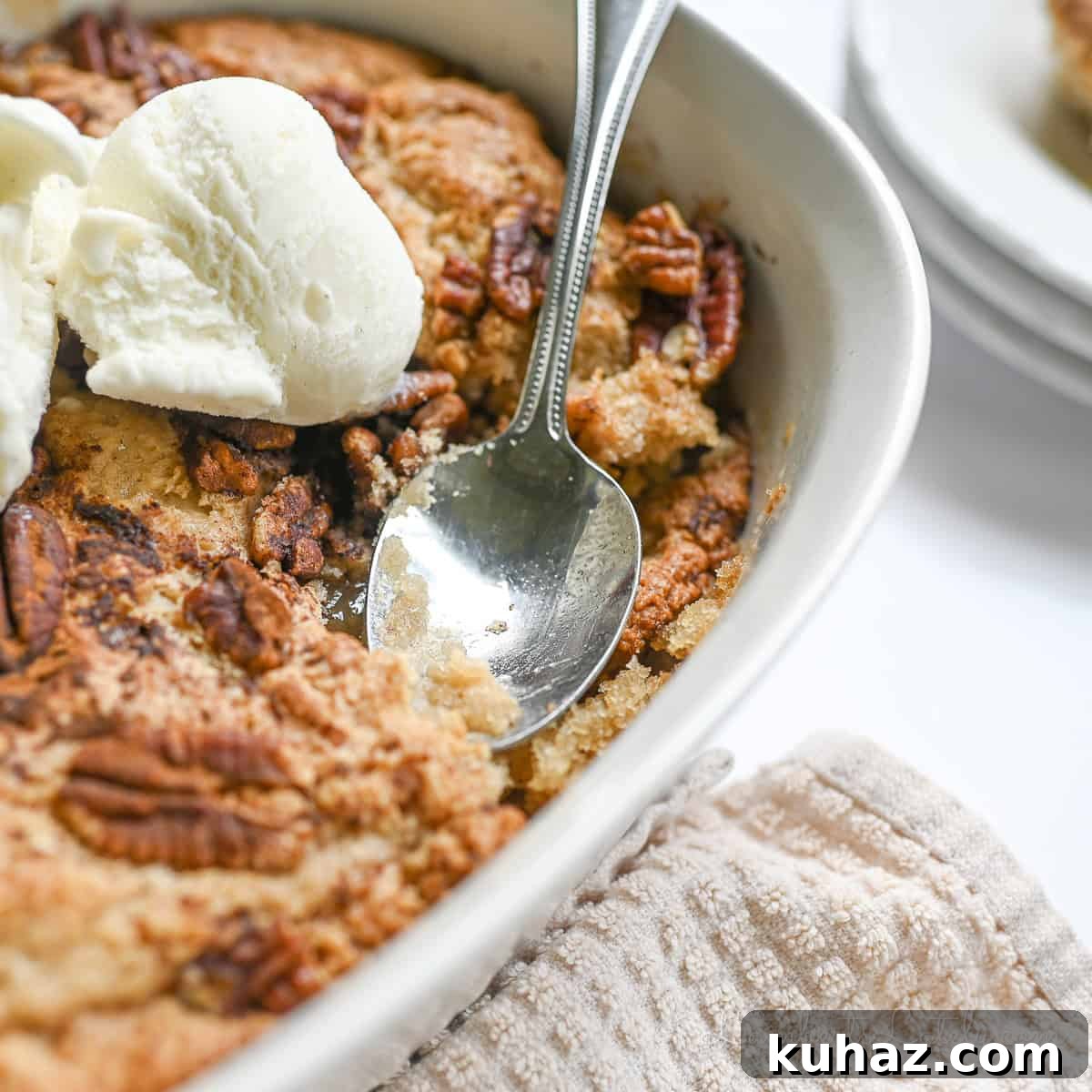 No Bake Pecan Pie Dip with Cream Cheese 11 spoon in a pecan cobbler.