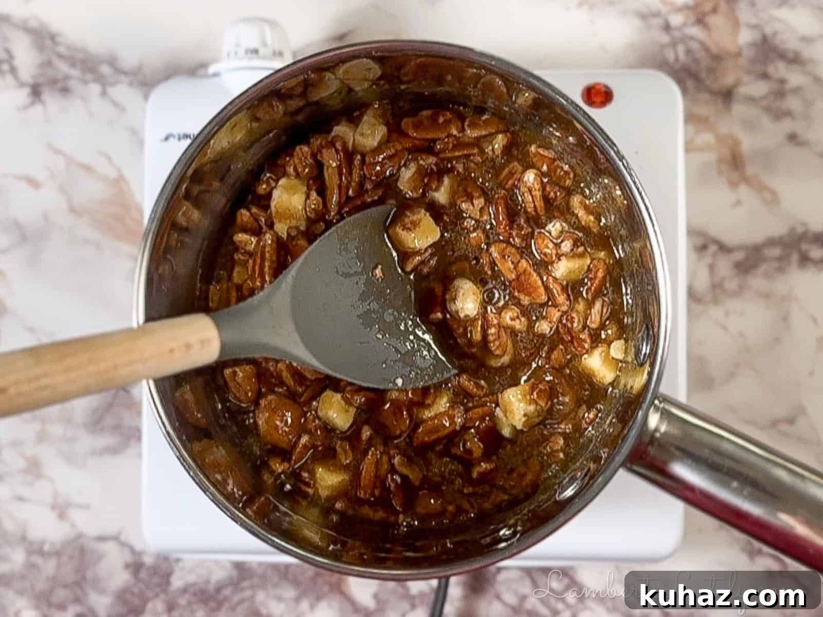 No Bake Pecan Pie Dip with Cream Cheese 5 cooking pecan pie mixture in a saucepan.