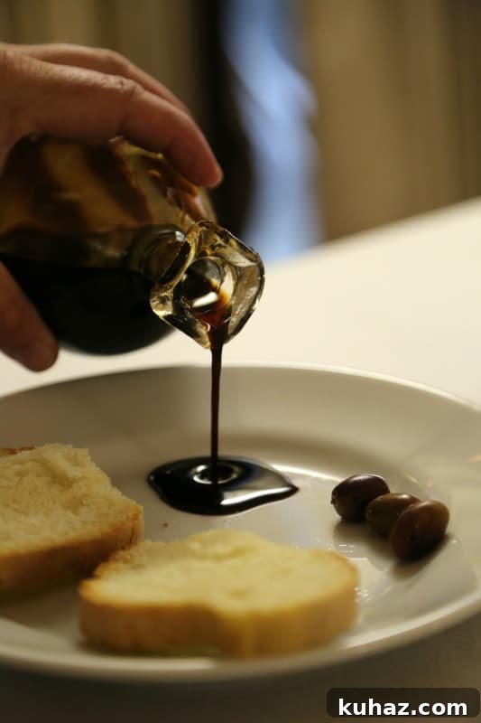 Tuscany Wine Tasting Shore Excursion from Cruise Ports 6 hand pouring balsamic vinegar