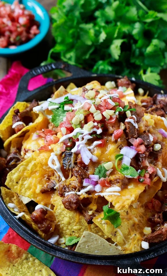 Loaded BBQ Brisket Nachos with Cheese 3 BBQ Brisket Nachos - perfect for game day and a great way to use up leftover brisket!