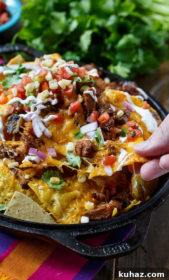 Loaded BBQ Brisket Nachos with Cheese 5 BBQ Brisket Nachos- perfect for game day and a great way to use up leftover brisket.