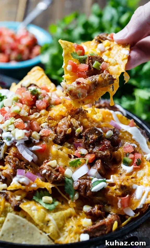 Loaded BBQ Brisket Nachos with Cheese 7 BBQ Brisket Nachos- perfect for game day and a great way to use up leftover brisket.
