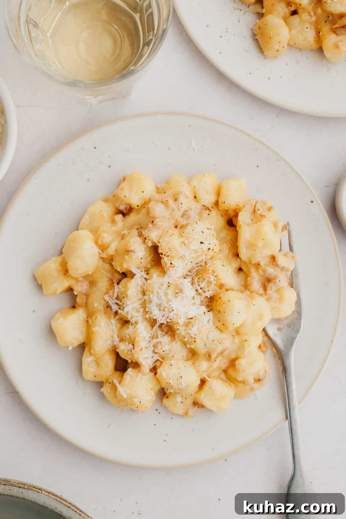 Gnocchi carbonara on a white plate.