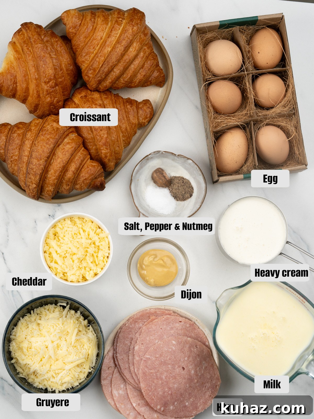 Make-Ahead Ham and Cheese Croissant Breakfast Casserole 5 Ingredients for breakfast casserole - Croissants, Eggs, Milk, Heavy cream, Gruyere and Cheddar, Ham, Dijon mustard, salt, pepper and nutmeg.