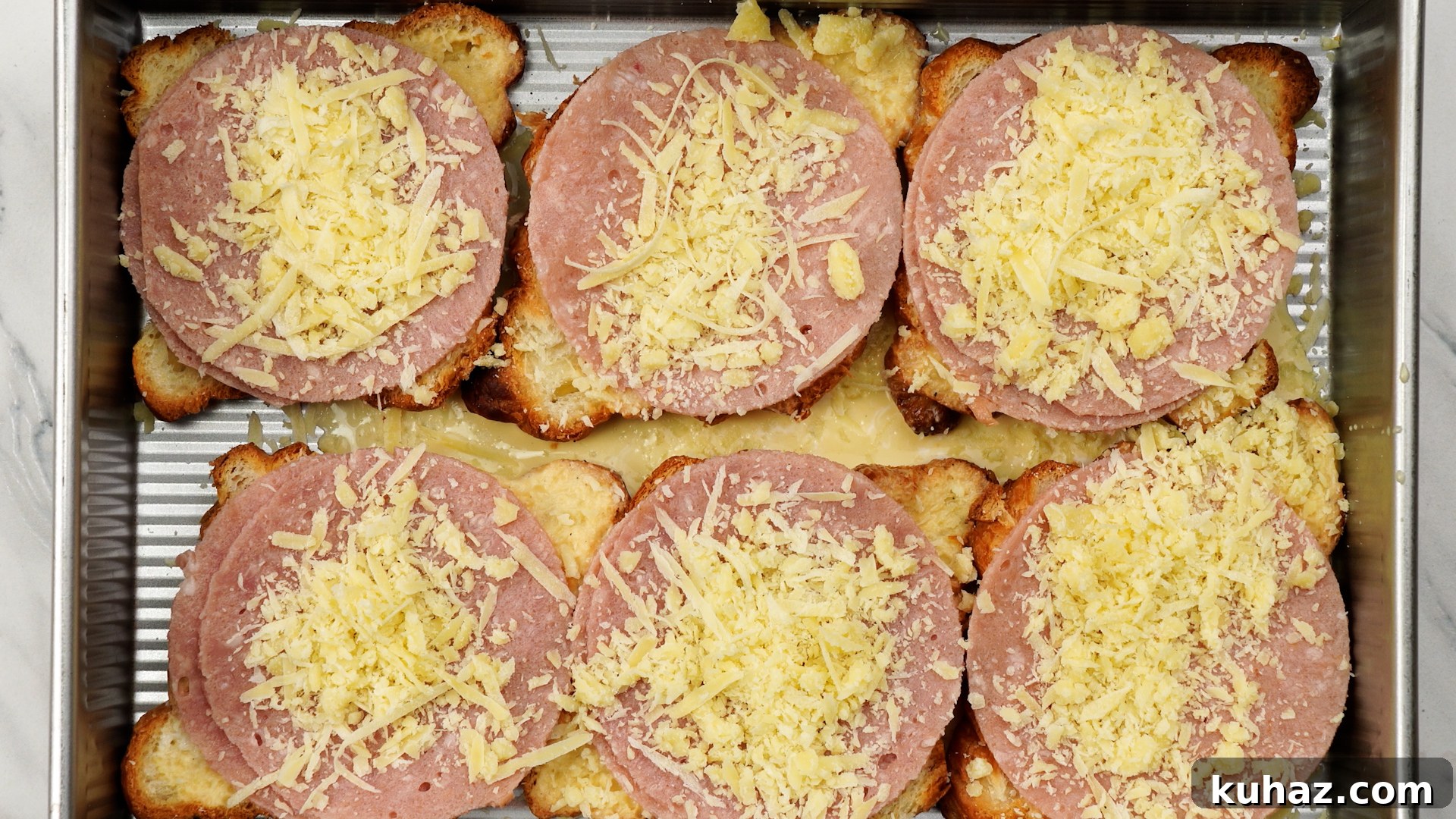 Make-Ahead Ham and Cheese Croissant Breakfast Casserole 8 Croissants then layered with Ham and cheese