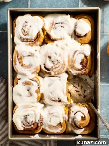 Sourdough Discard Pumpkin Cinnamon Rolls in a baking pan.