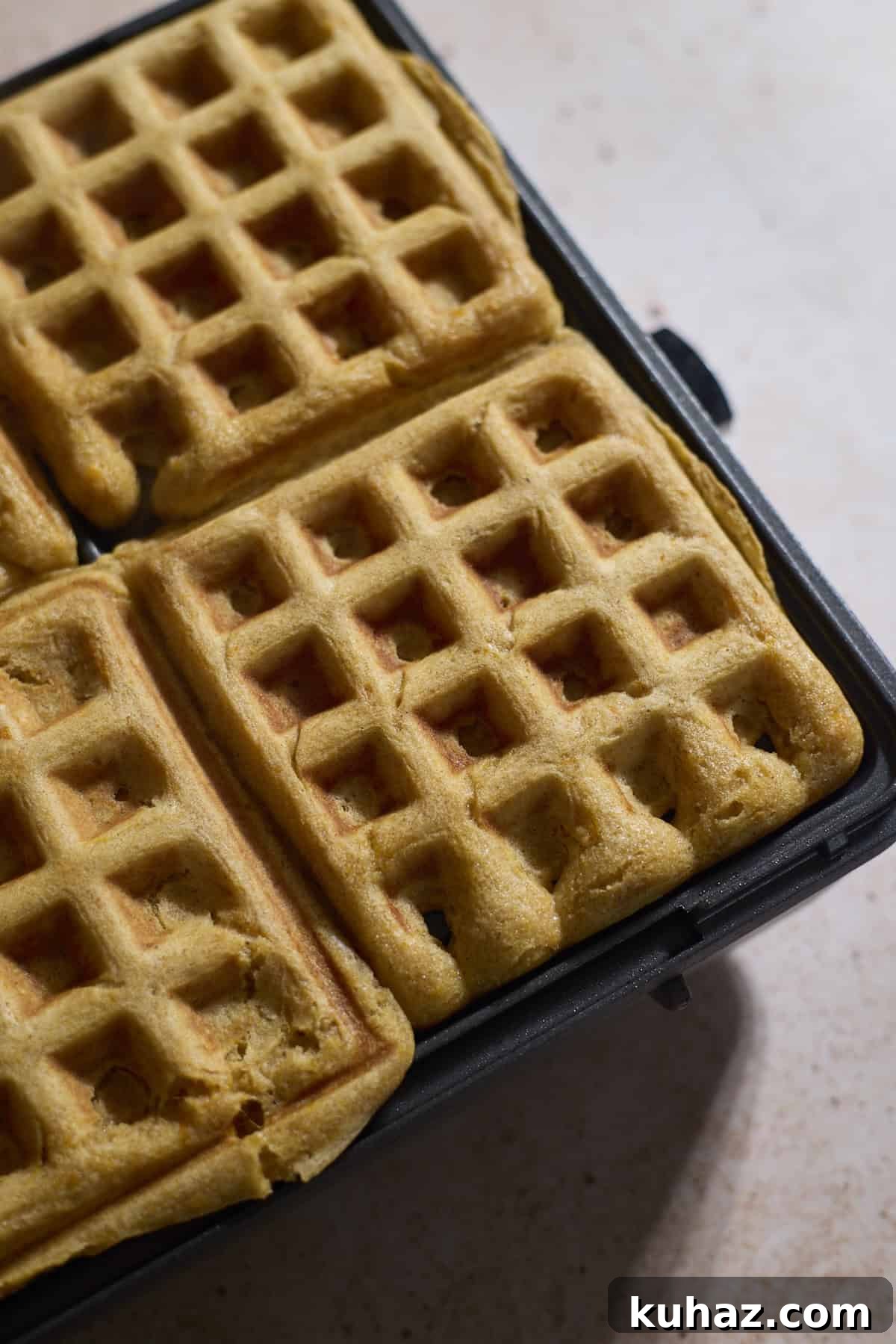 Crispy Sourdough Sweet Potato Waffles 8 Wafles after baking in the waffle iron.