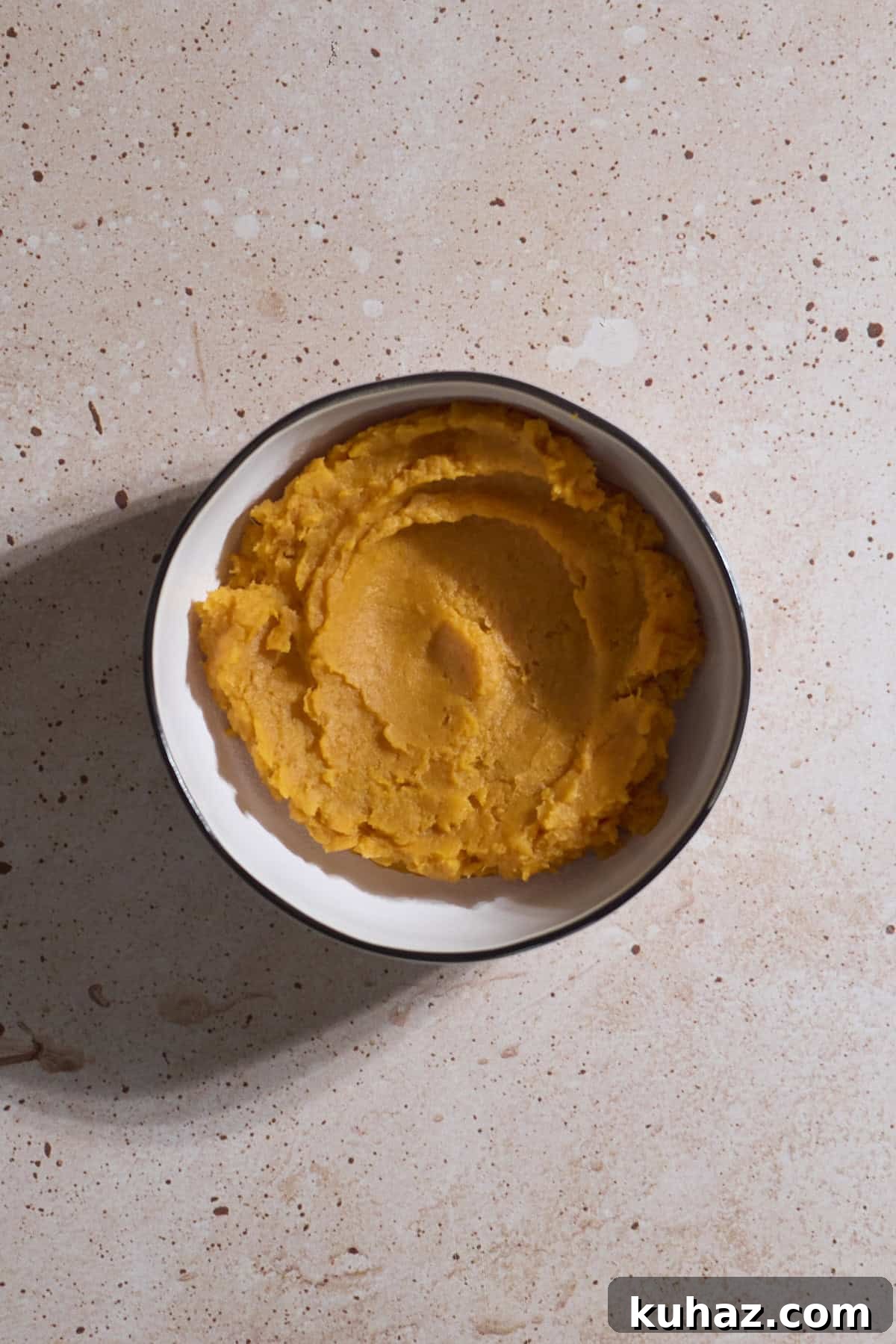 Crispy Sourdough Sweet Potato Waffles 10 Sweet potato purée in a white bowl.