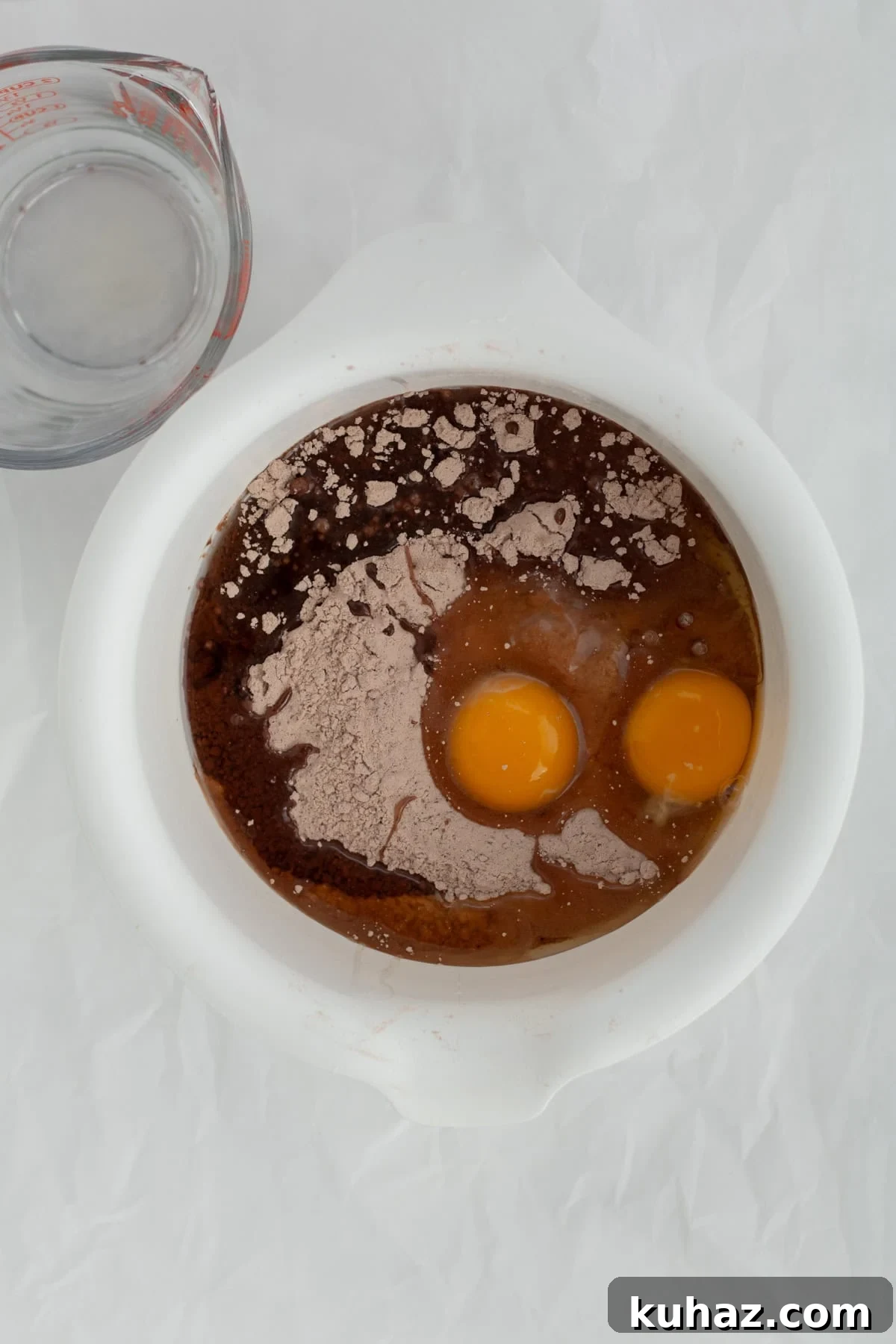 Chewy 4-Ingredient Brownie Mix Cookies 7 brownie mix with eggs, water and oil in a mixing bowl