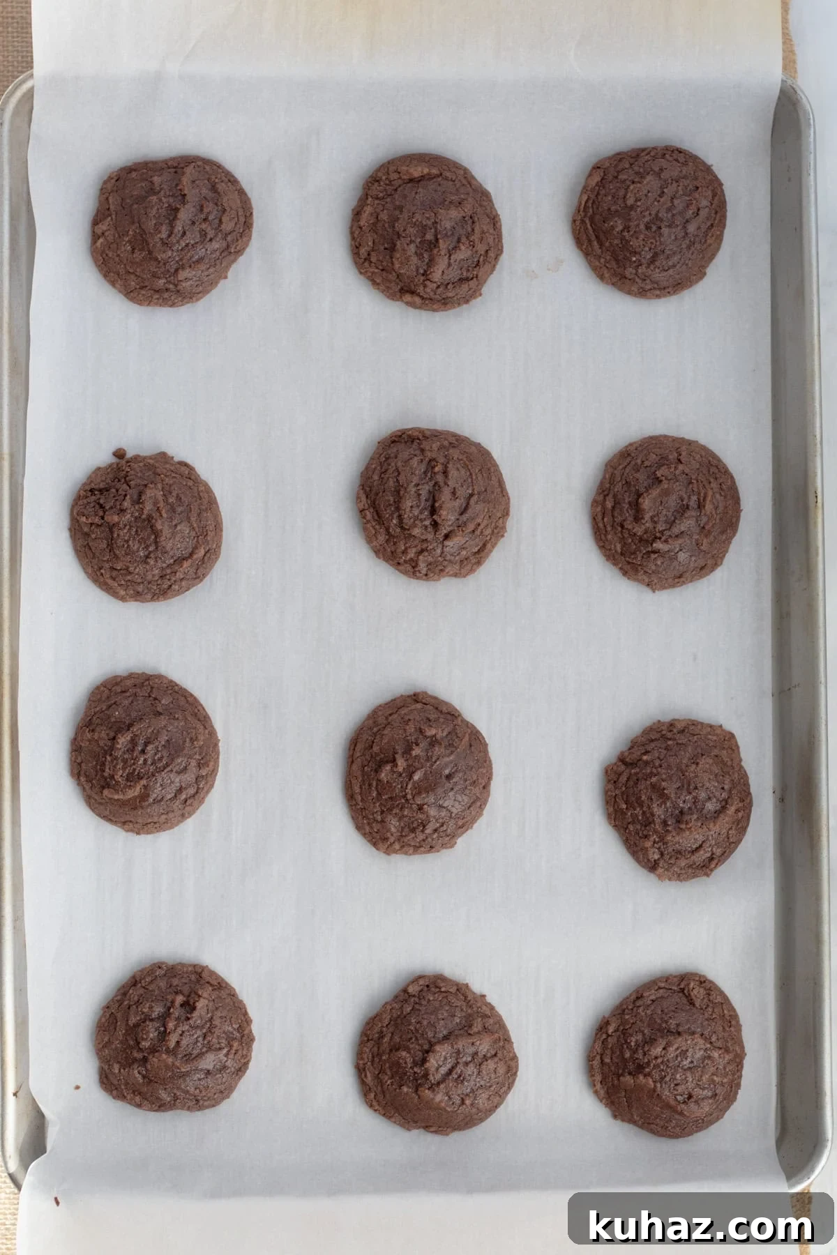 Chewy 4-Ingredient Brownie Mix Cookies 9 baked cookies on parchment lined baking sheet