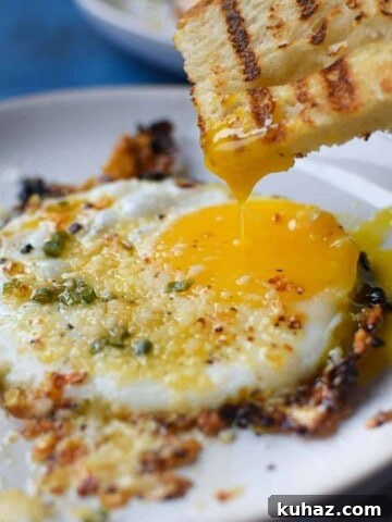 Homemade Maple Sage Breakfast Sausage Patties Recipe 6 Fried egg with bread being dunked in a runny yolk.