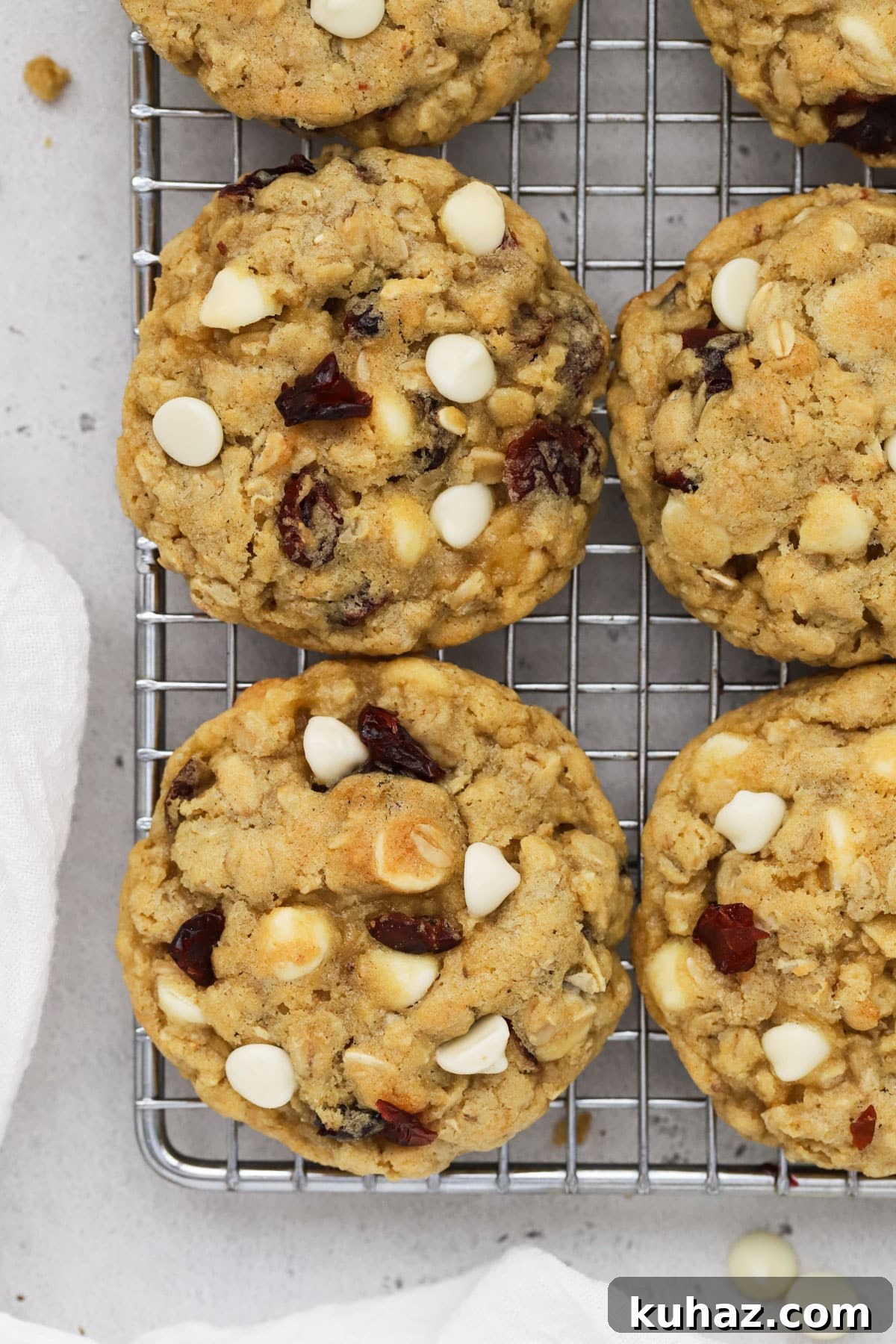 Gluten Free Cranberry White Chocolate Oatmeal Cookies 2 gluten-free cranberry white chocolate chip oatmeal cookies cooling on a wire rack