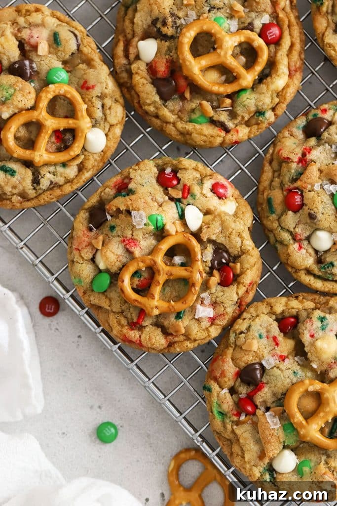Gluten Free Cranberry White Chocolate Oatmeal Cookies 9 freshly baked gluten-free Christmas kitchen sink cookies on a cooling rack
