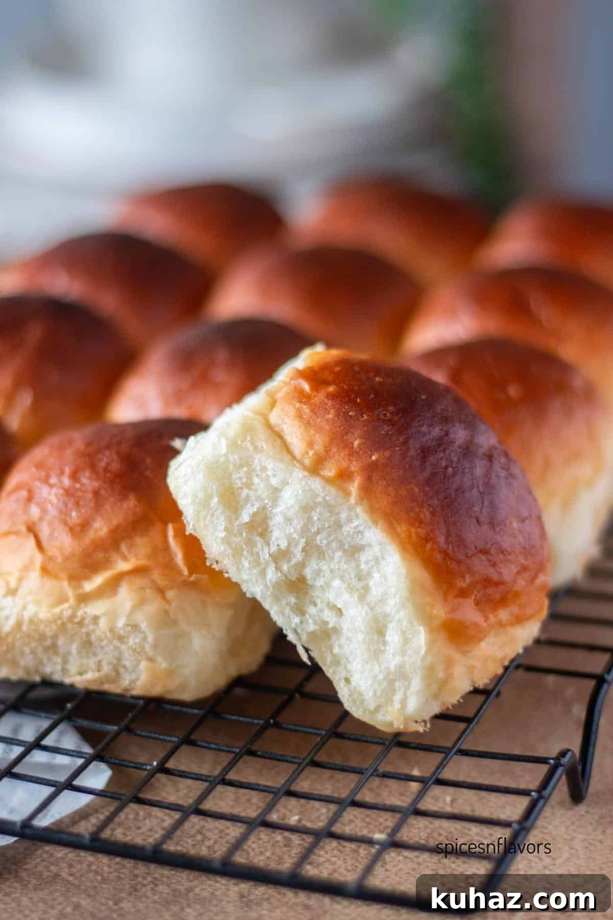 Fluffy Homemade Bread Machine Dinner Rolls Recipe 12 side view of the bread dinner roll placed on wire rack