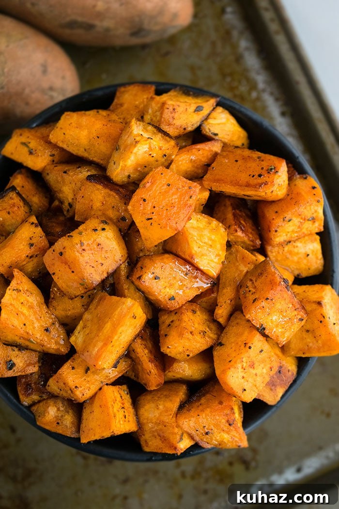 Sheet Pan Roasted Sweet Potatoes 2 Easy Crispy Oven Roasted Sweet Potatoes in Black Bowl.