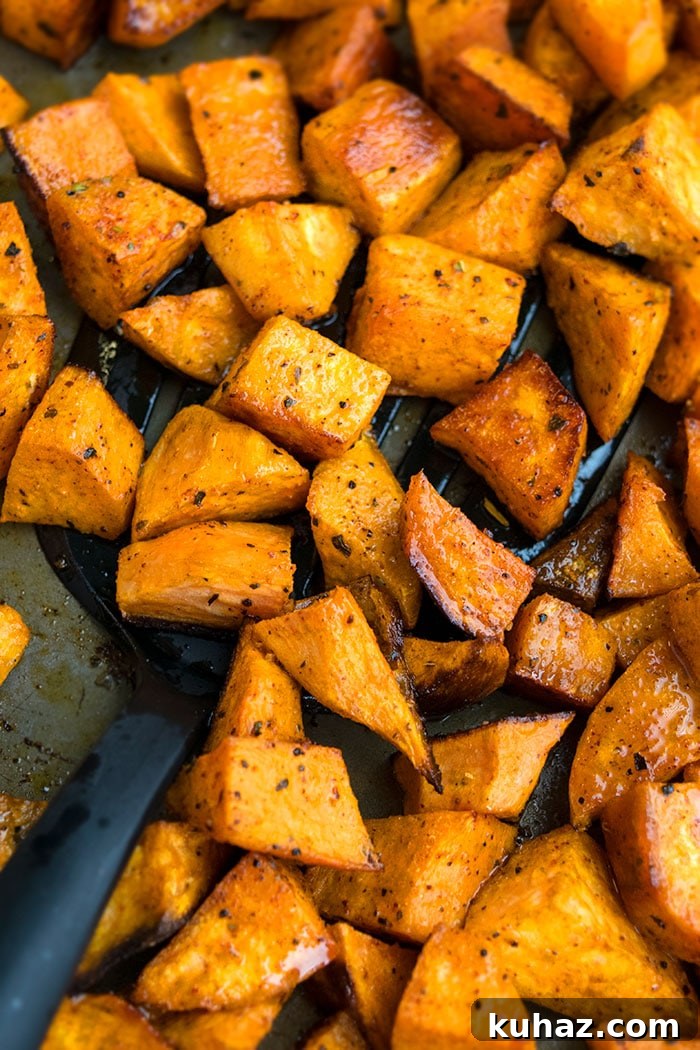 Sheet Pan Roasted Sweet Potatoes 3 Seasoned Baked Sweet Potatoes in Tray.