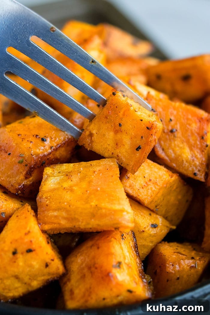 Sheet Pan Roasted Sweet Potatoes 4 Fork With Sweet Potato- Closeup Shot.