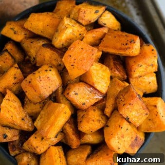 Easy Crispy Oven Roasted Sweet Potatoes in Black Bowl.