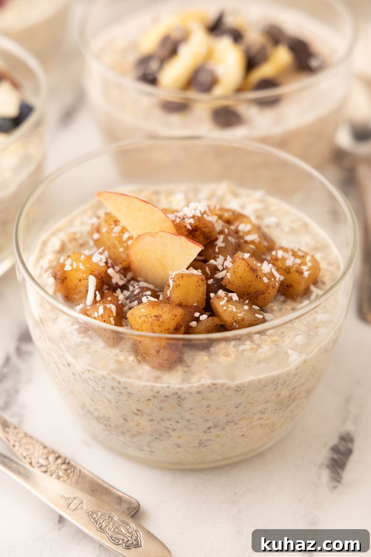 High-Protein Overnight Oats with Chia Seeds Recipe 6 Overnight oats topped with apple cinnamon compote in a glass bowl.
