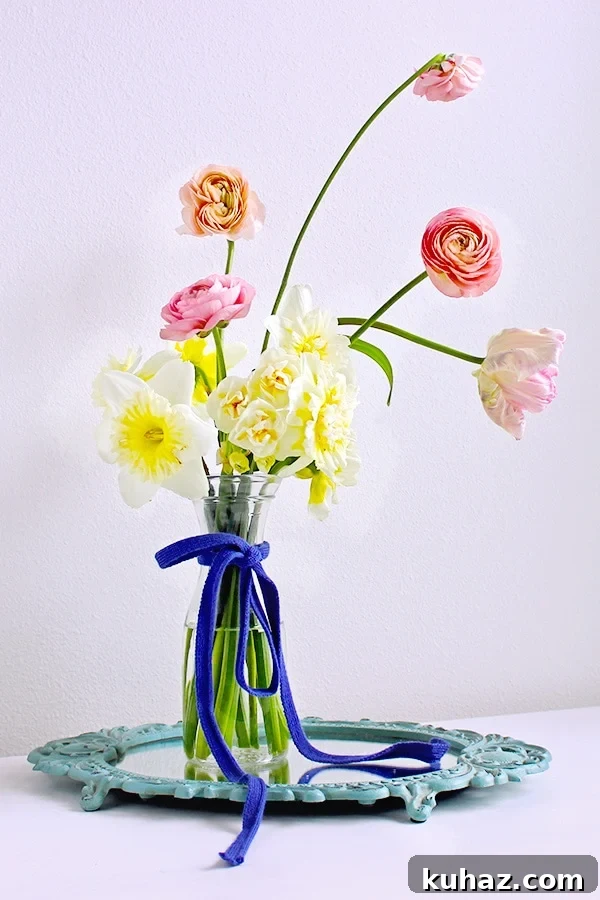 DIY Mirror Centerpiece with Pink Peonies 2 Learn how to prevent a simple floral arrangement from looking cheap in this tutorial for a floral arrangement with pink peonies on a mirror centerpiece.