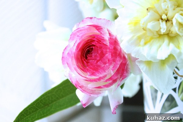 DIY Mirror Centerpiece with Pink Peonies 3 Learn how to prevent a simple floral arrangement from looking cheap in this tutorial for a floral arrangement with pink peonies on a mirror centerpiece.