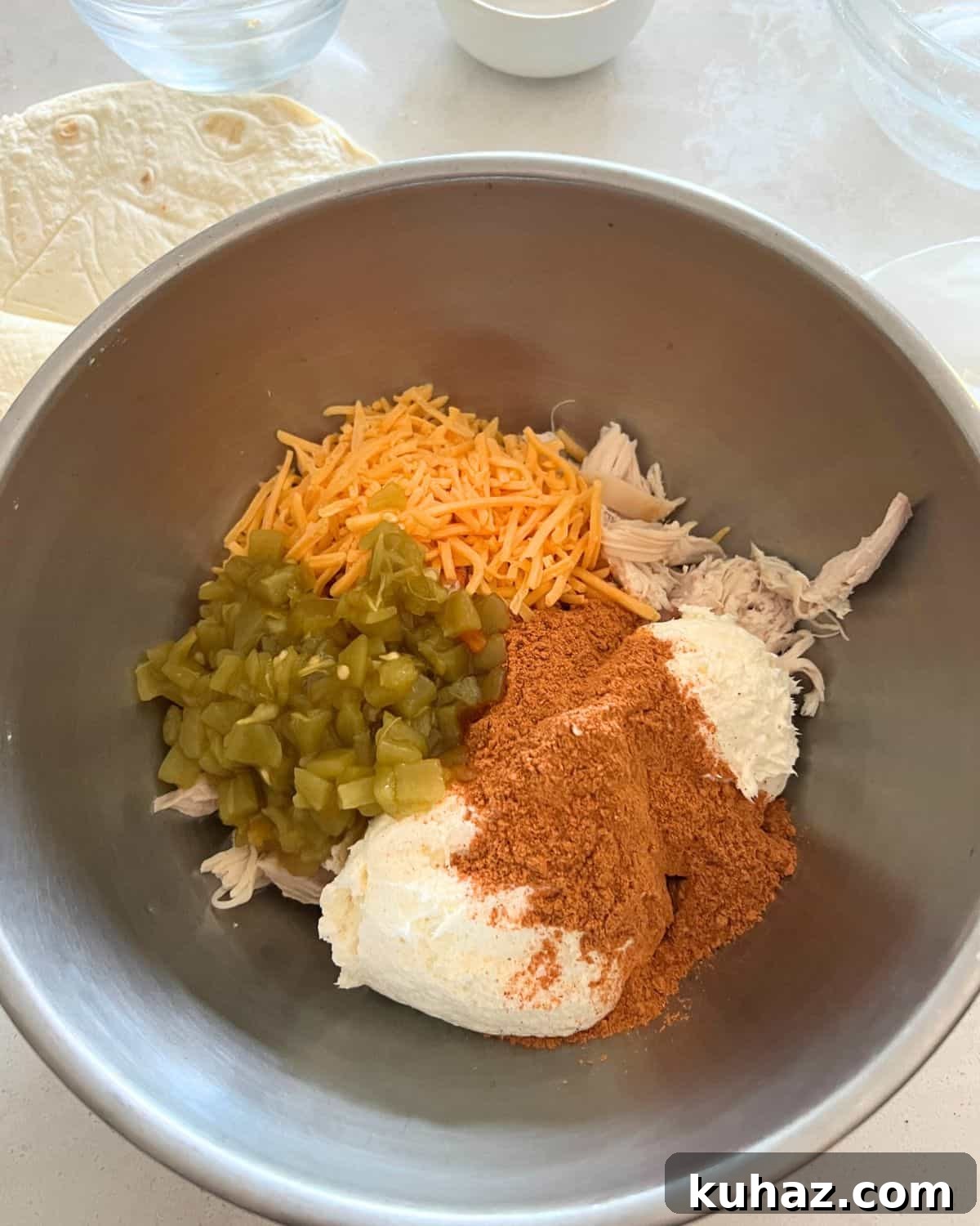 Crispy Air Fryer Chicken Chimichangas 4 Ingredients for chimichangas together in a bowl.