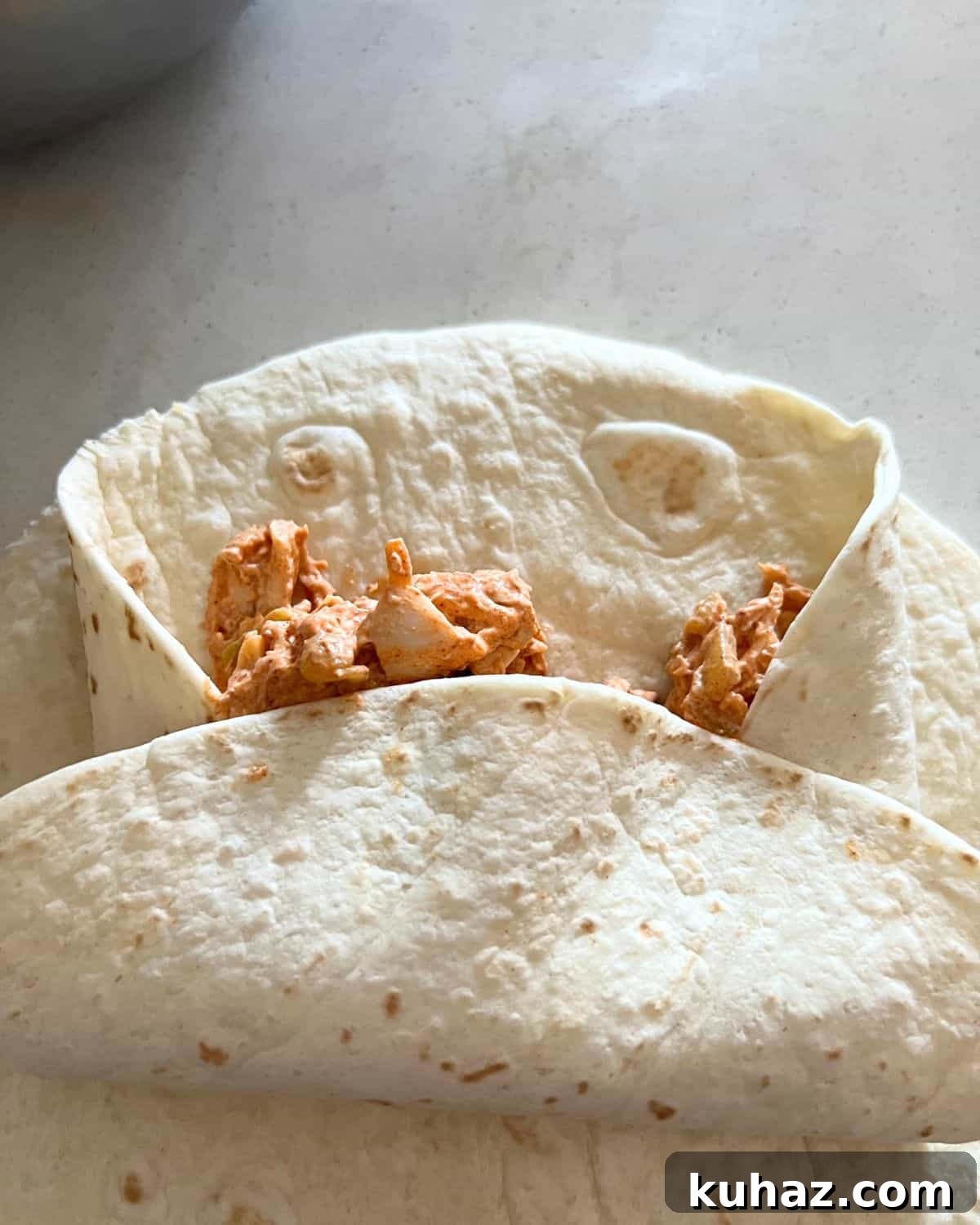 Crispy Air Fryer Chicken Chimichangas 5 Folded up chimichanga ready for air fryer.