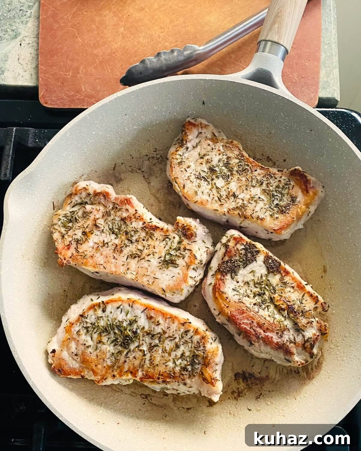 Pan frying pork chops.