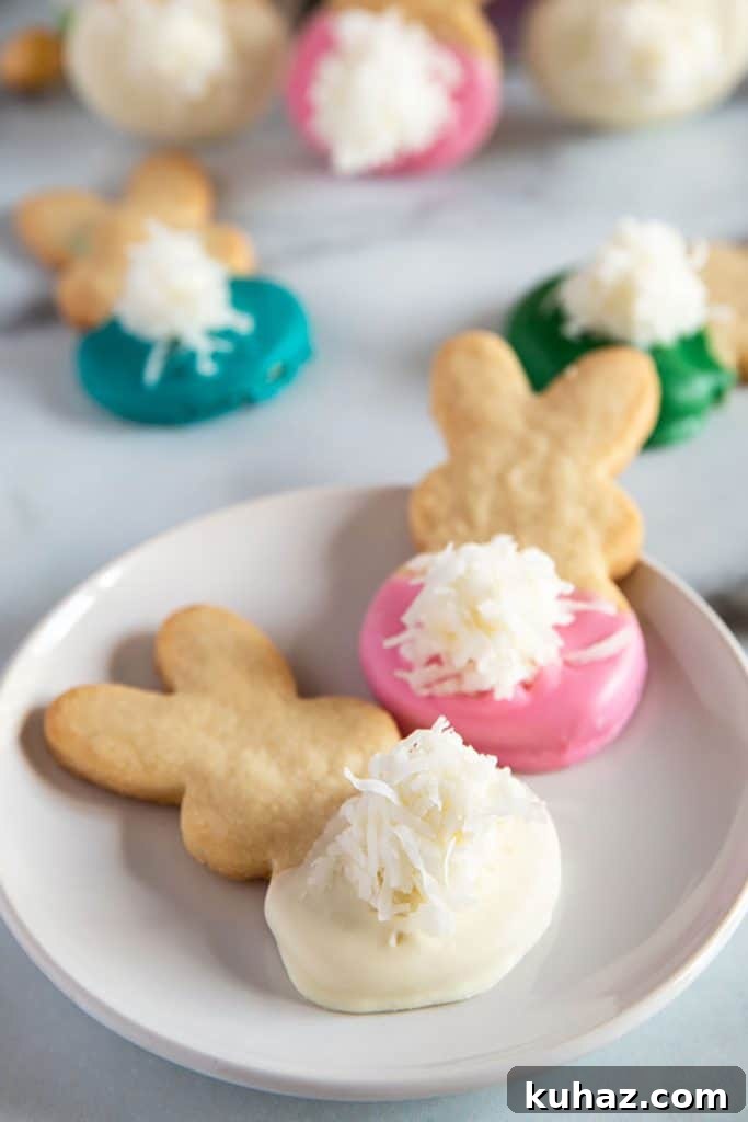 Easter Bunny Cookies with Fluffy Marshmallow Tails 2 Easter Bunny Cookies with fluffy tails on a plate