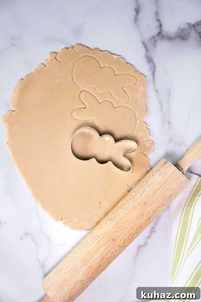Easter Bunny Cookies with Fluffy Marshmallow Tails 12 cutting the dough with a bunny shaped cookie cutter