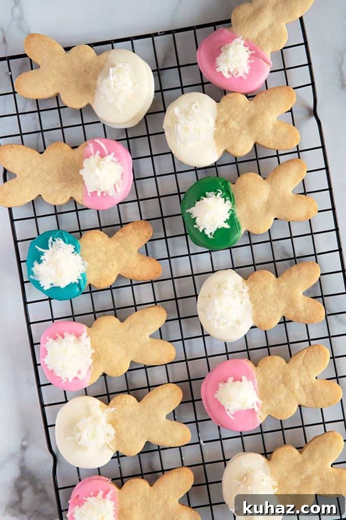 Easter Bunny Cookies with Fluffy Marshmallow Tails 17 top view of twelve easter bunny cookies over a cooling rack