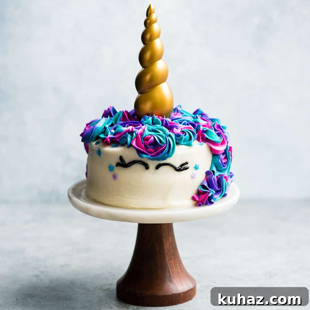 A simple and easy Unicorn cake! My daughter LOVED this for her birthday cake! #unicorncake #unicorn #cake #cakedecorating front view of a Unicorn Cake