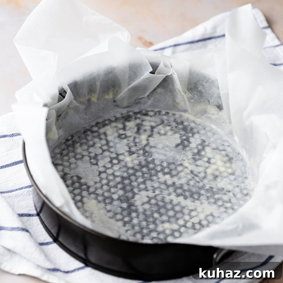 Basque Burnt Cheesecake Recipe — Silky, Caramelized Top 4 round baking tin lined with baking paper that overhangs