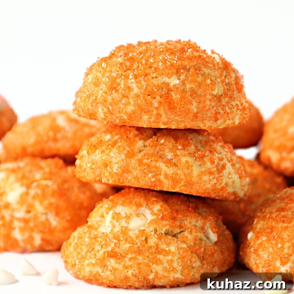 10 Traditional Chinese New Year Treats to Try 5 Stack of puffy cookies coated in orange sparkle sugar.