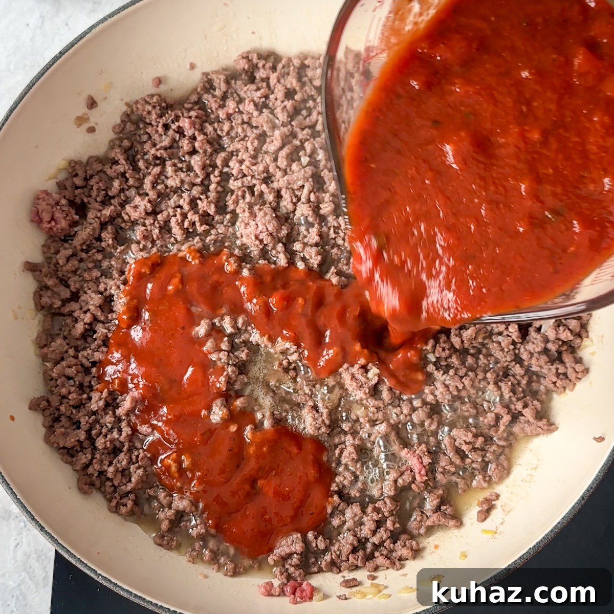 How to Make Cheesy, Savory Sloppy Joe Sliders 5 Add in the beef and our sauce mixture!