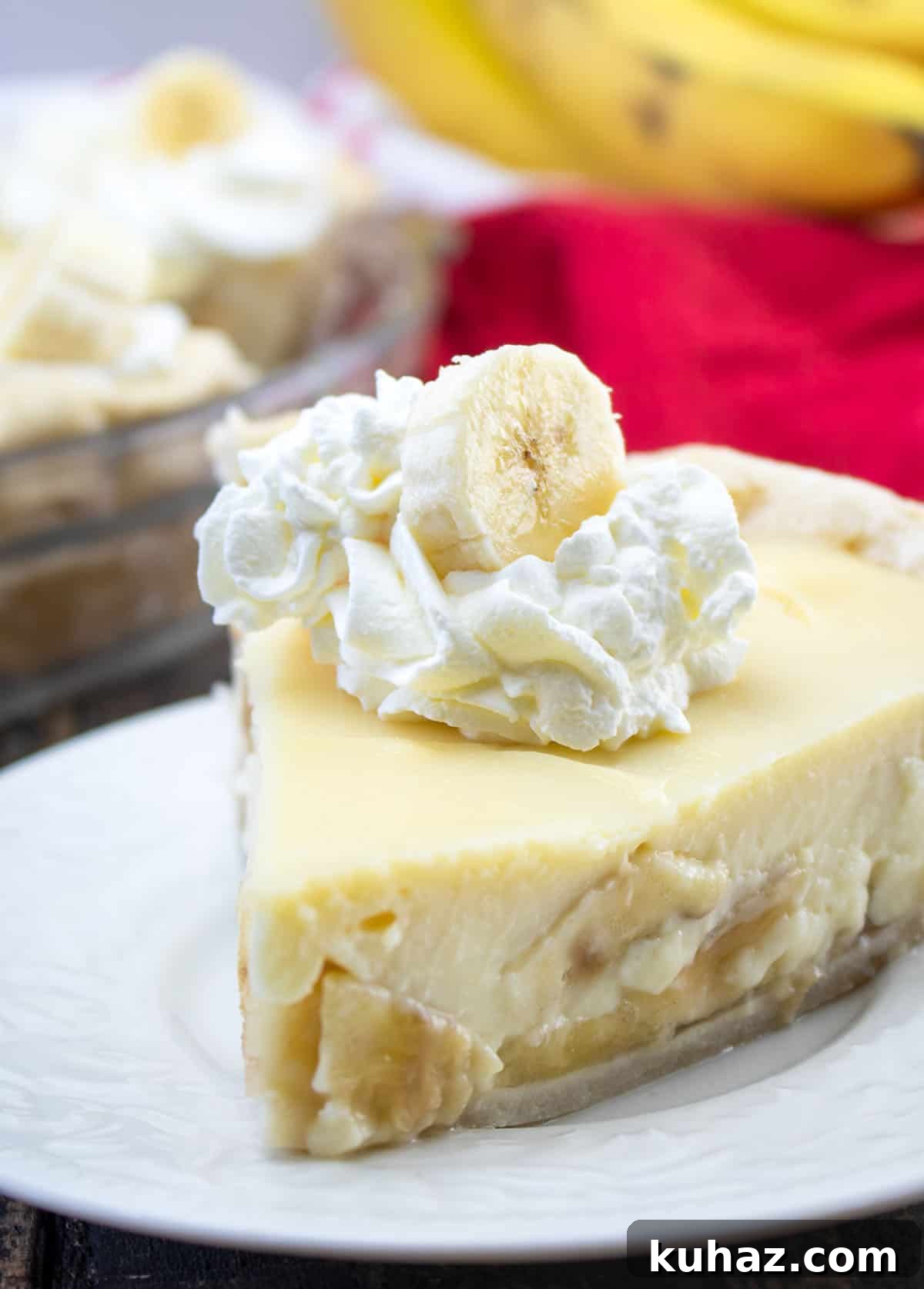 Gluten-Free Banana Cream Pie Recipe 2 slice of pie with whipped cream and banana slice on top