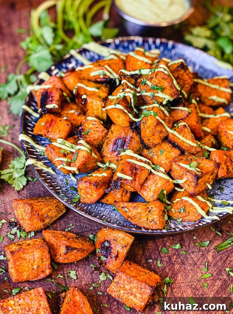 How to Grill or Roast Sweet Potatoes 11 blue plate piled with roasted sweet potato cubes