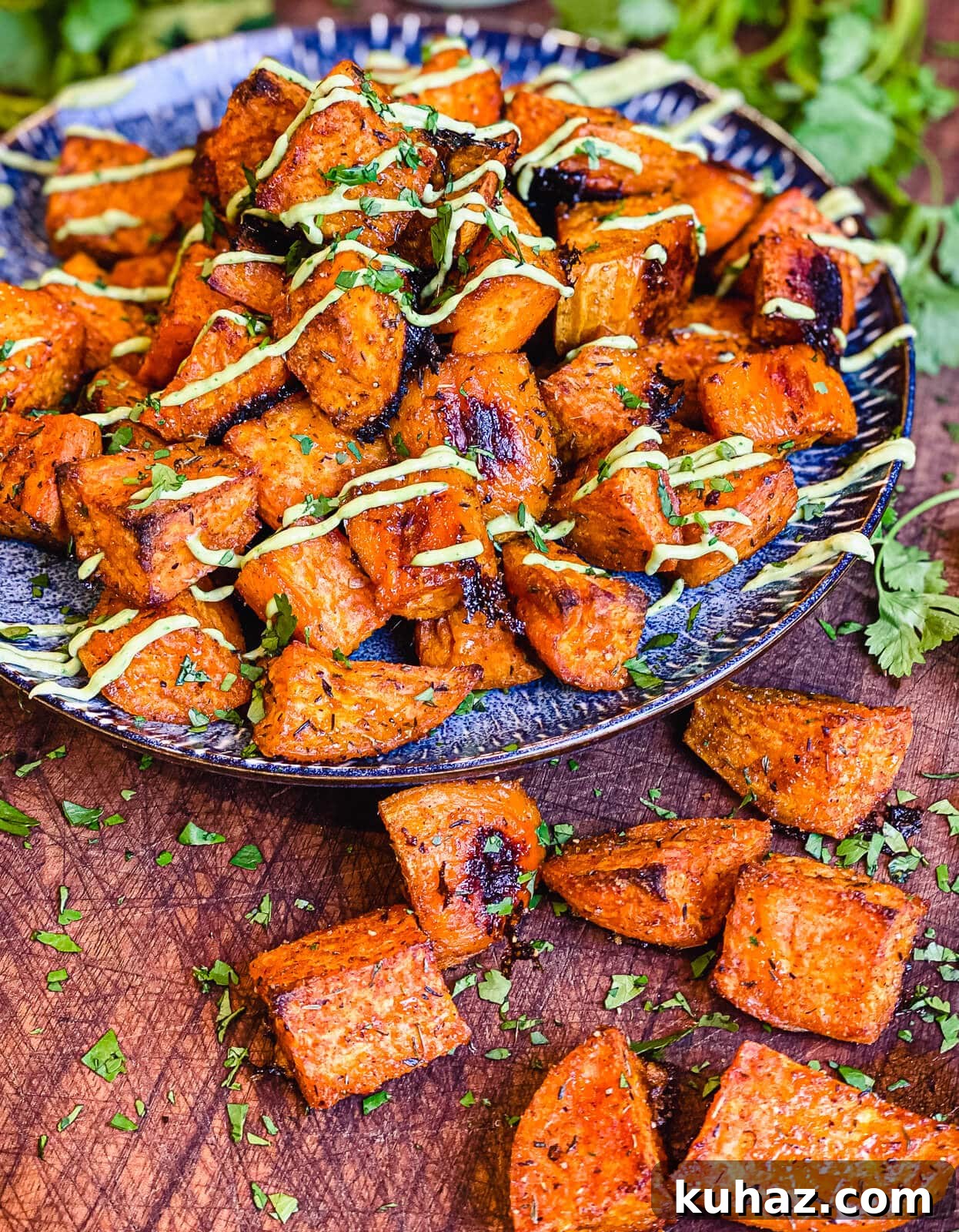 How to Grill or Roast Sweet Potatoes 12 roasted sweet potatoes and avocado cream on a plate