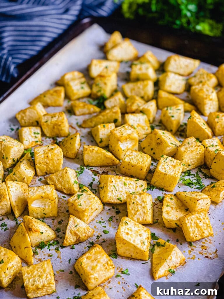 How to Grill or Roast Sweet Potatoes 3 Roasted celery root on a baking sheet with parsley