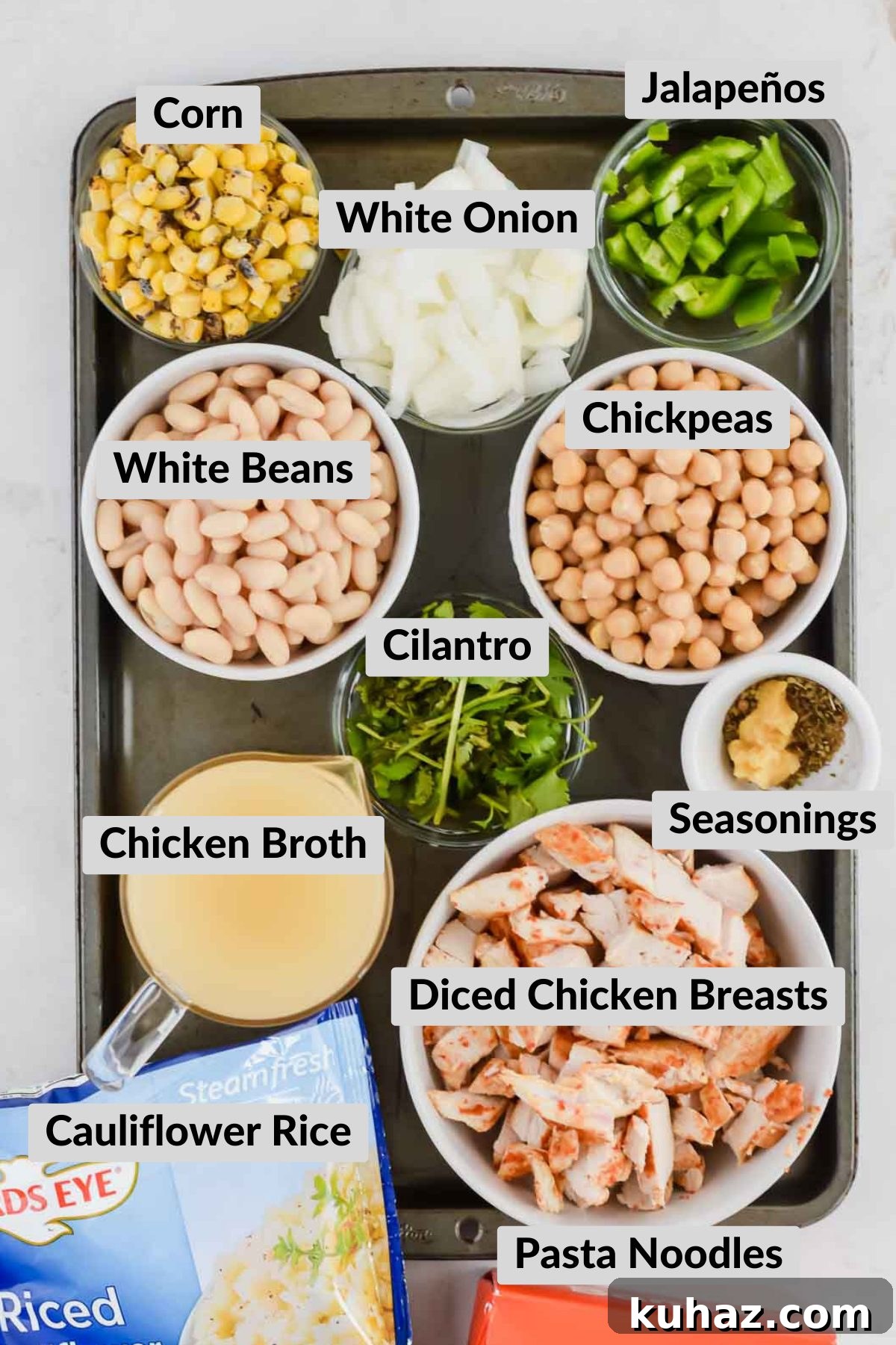 Dairy-Free White Chicken Chili Recipe 3 Ingredients for Dairy Free White Chicken Chili Recipe in individual bowls on gray baking sheet.
