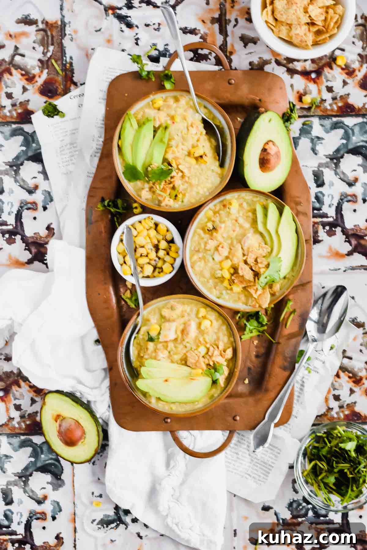 Dairy-Free White Chicken Chili Recipe 8 Three bowls of Dairy Free White Chicken Chili recipe on a metal serving tray.