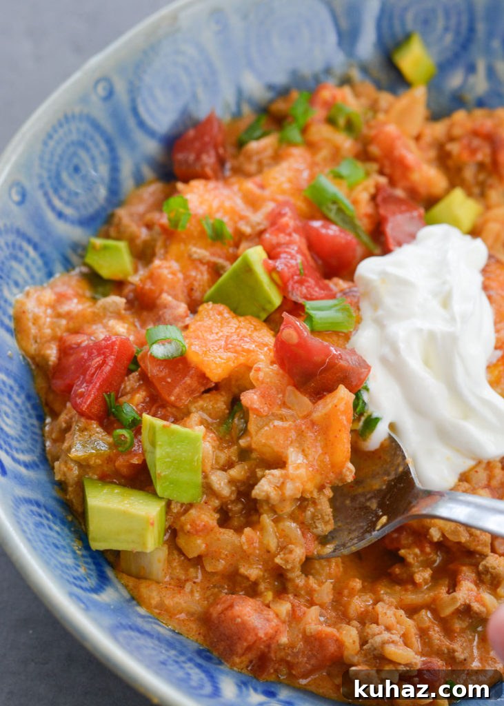 This low carb Keto Taco Casserole is loaded with seasoned ground beef, vegetables and loads of cheese!
