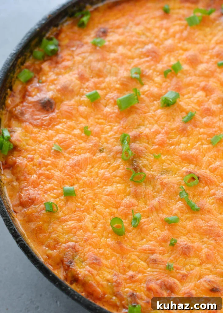 This low carb Keto Taco Casserole is loaded with seasoned ground beef, vegetables and loads of cheese!